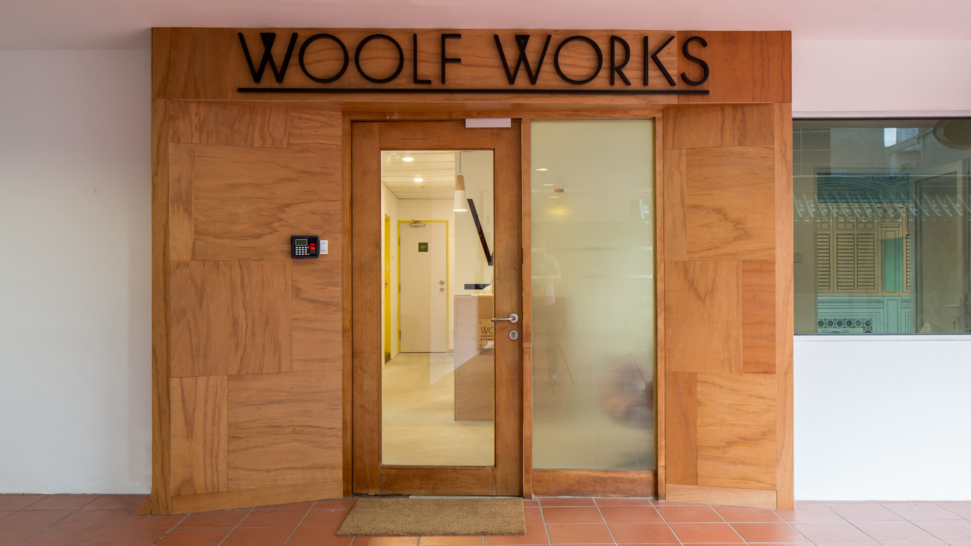 Woolf Works office interior design by Aym Design entrance